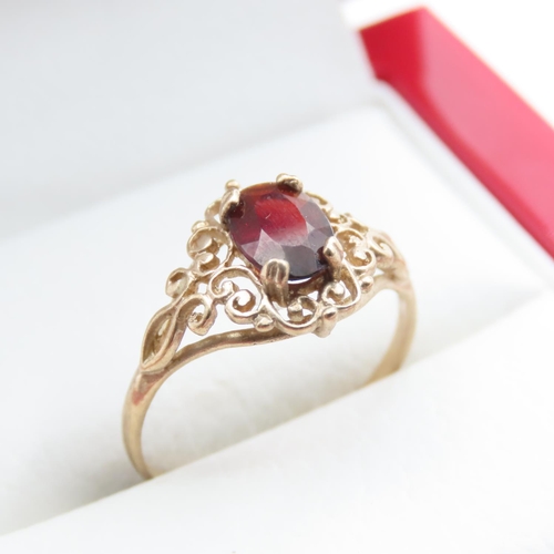 1374 - Red Garnet Ladies Ring Set in 9 Carat Yellow Gold Ring Size M