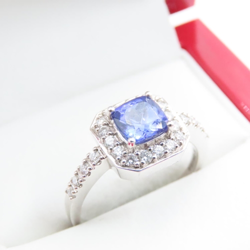 1613 - Cushion Cut Tanzanite Ring Mounted in Platinum with Further Diamond Halo Set Ring Size R