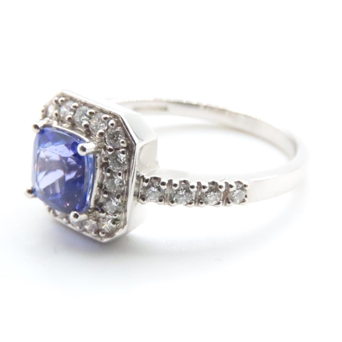 1613 - Cushion Cut Tanzanite Ring Mounted in Platinum with Further Diamond Halo Set Ring Size R