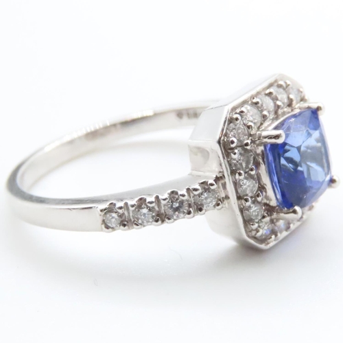 1613 - Cushion Cut Tanzanite Ring Mounted in Platinum with Further Diamond Halo Set Ring Size R