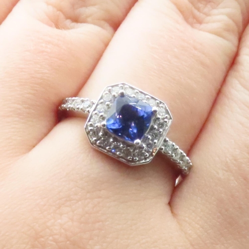 1613 - Cushion Cut Tanzanite Ring Mounted in Platinum with Further Diamond Halo Set Ring Size R