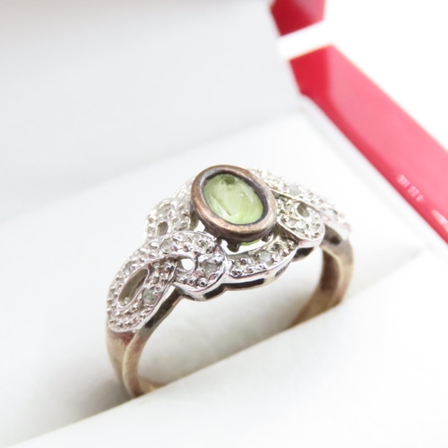 1632 - Bezel Set Peridot and Diamond Cluster Ring Mounted in 9 Carat Yellow Gold Ring Size M