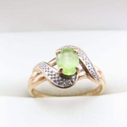 1637 - Peridot and Diamond Ring Set in 9 Carat Yellow Gold Ring Size O