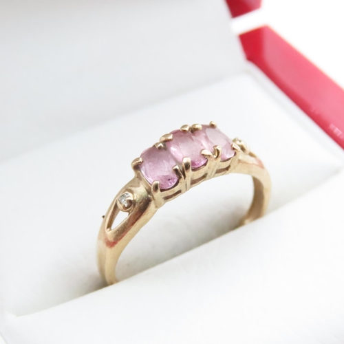 1638 - Three Stone Pink Garnet Ring Set in 9 Carat Yellow Gold Ring Size N and a Half