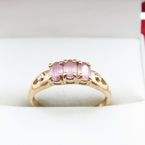 1638 - Three Stone Pink Garnet Ring Set in 9 Carat Yellow Gold Ring Size N and a Half