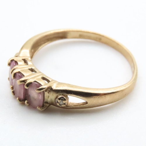 1638 - Three Stone Pink Garnet Ring Set in 9 Carat Yellow Gold Ring Size N and a Half