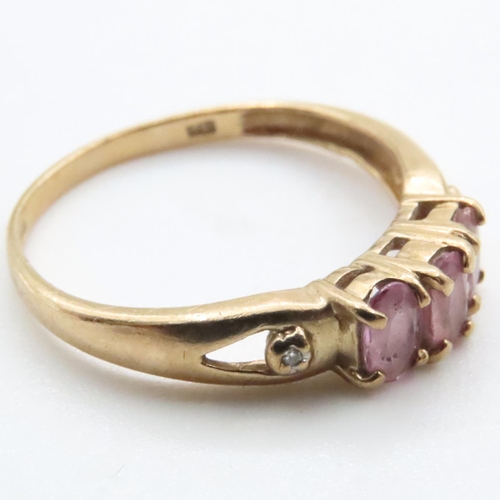 1638 - Three Stone Pink Garnet Ring Set in 9 Carat Yellow Gold Ring Size N and a Half