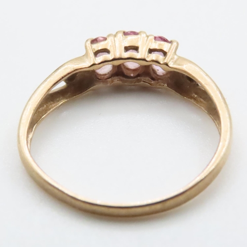 1638 - Three Stone Pink Garnet Ring Set in 9 Carat Yellow Gold Ring Size N and a Half