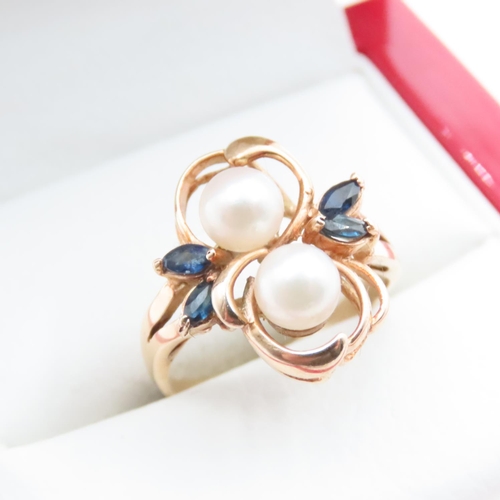 1651 - Unusual Floral Design Pearl and Sapphire Set Ring Mounted on 14 Carat Yellow Gold Band Ring Size M