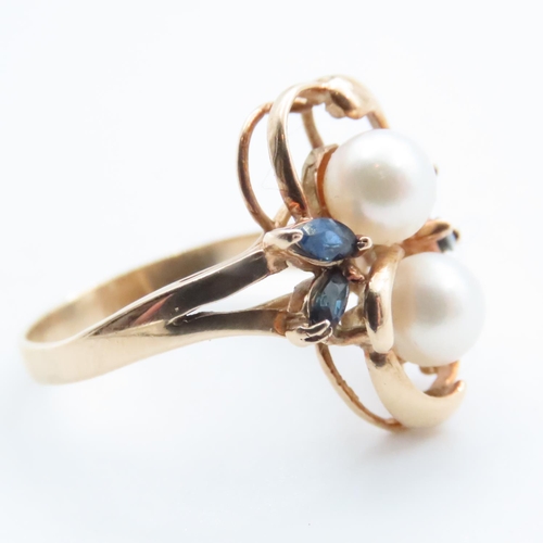 1651 - Unusual Floral Design Pearl and Sapphire Set Ring Mounted on 14 Carat Yellow Gold Band Ring Size M