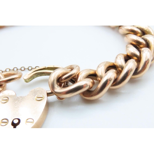 1662 - 9 Carat Yellow Gold Curb Link Heart Locket Bracelet 18cm Long