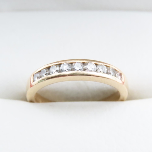 1673 - 14 Carat Yellow Gold Channel Set Diamond Half Eternity Ring Size N