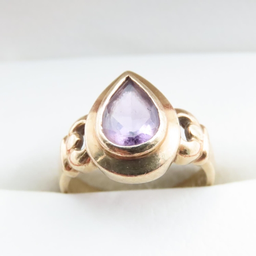 1705 - Pear Cut Bezel Set Amethyst Ring Mounted on 9 Carat Yellow Gold Band Ring Size L