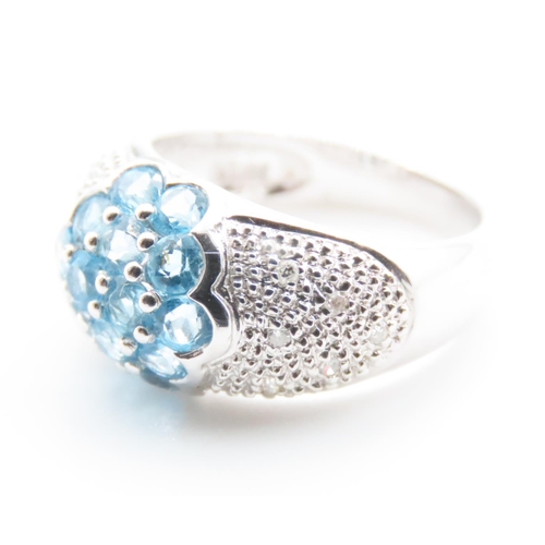 1719 - Blue Topaz and Diamond Cluster Dome Ring Mounted on 10 Carat White Gold Band Ring Size N