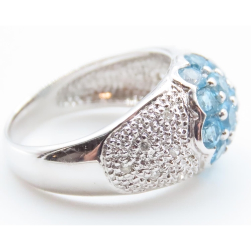 1719 - Blue Topaz and Diamond Cluster Dome Ring Mounted on 10 Carat White Gold Band Ring Size N