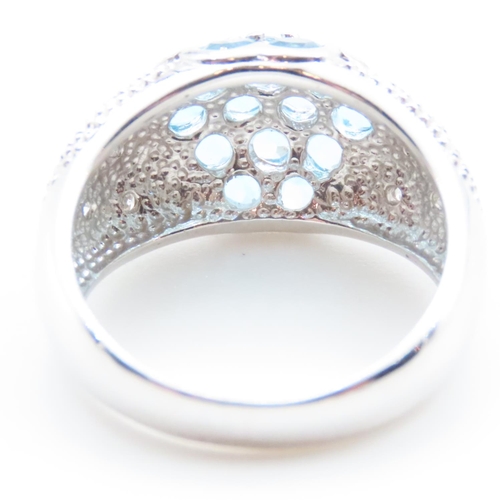 1719 - Blue Topaz and Diamond Cluster Dome Ring Mounted on 10 Carat White Gold Band Ring Size N