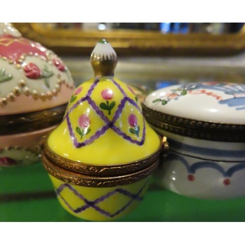 236 - Four Decorated Fine Porcelain Pill or Ring Boxes Ormolu Bound Hinged Covers