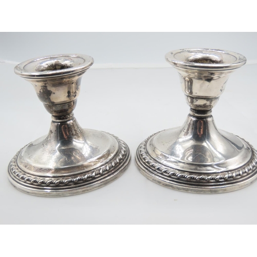 312 - Pair of Silver Turned Pedestal Form Candle Rests Each Approximately 4 Inches Diameter