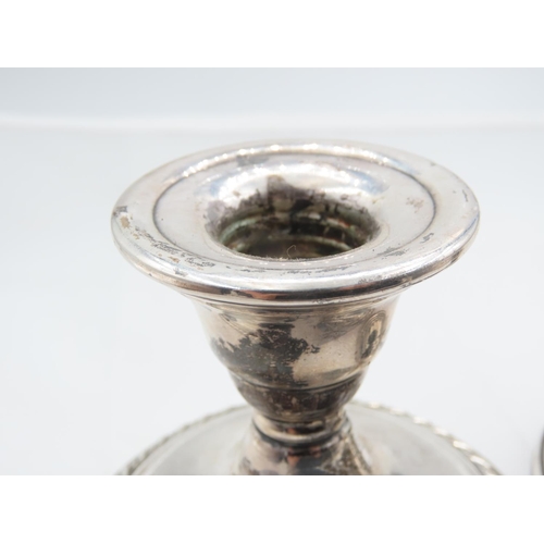 312 - Pair of Silver Turned Pedestal Form Candle Rests Each Approximately 4 Inches Diameter