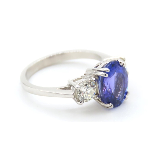 335 - Tanzanite and Diamond Three Stone Ring Mounted on Platinum Band Ring Size L and a Half