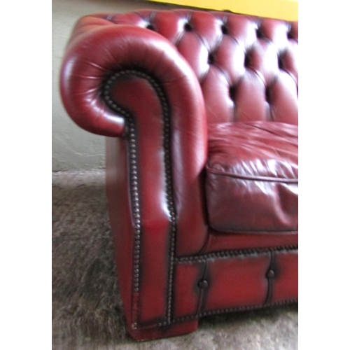 34 - Burgundy Leather Deep Button Upholstered Chesterfield Three Seater Settee Approximately 6ft 5 Inches... 