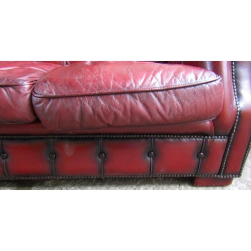 34 - Burgundy Leather Deep Button Upholstered Chesterfield Three Seater Settee Approximately 6ft 5 Inches... 