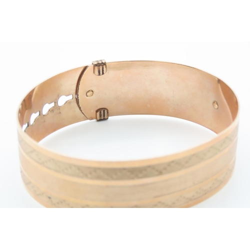 349 - Nine Carat Rose Gold Buckle Motif Bangle