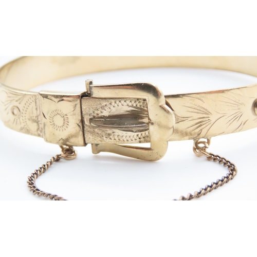 353 - Filled Gold Ladies Buckle Motif Bangle with Safety Chain 6.5cm Inner Diameter