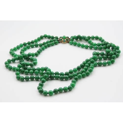 392 - Carved Apple Jade Three Strand Bead Necklace Nine Carat Yellow Gold Clasp Pearls of Attractive Hue