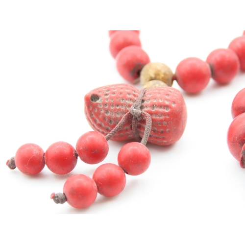 397 - Two Carved Red Coral Bead Bracelets