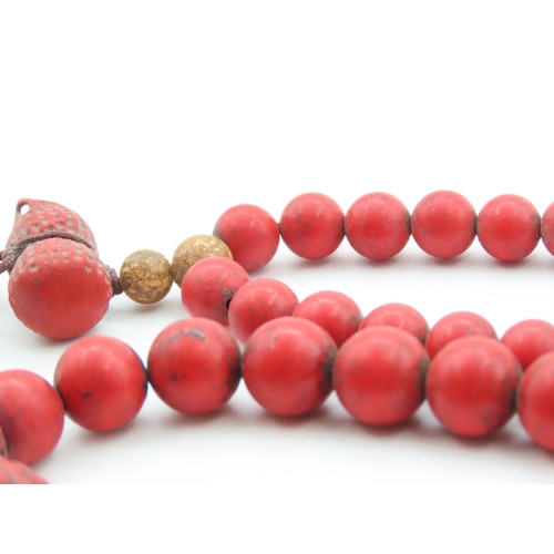 397 - Two Carved Red Coral Bead Bracelets