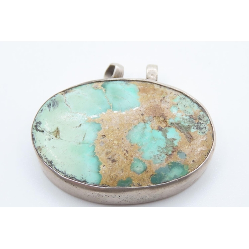 488 - Silver Mounted Turquoise Oval Set Pendant Approximately 4cm Wide