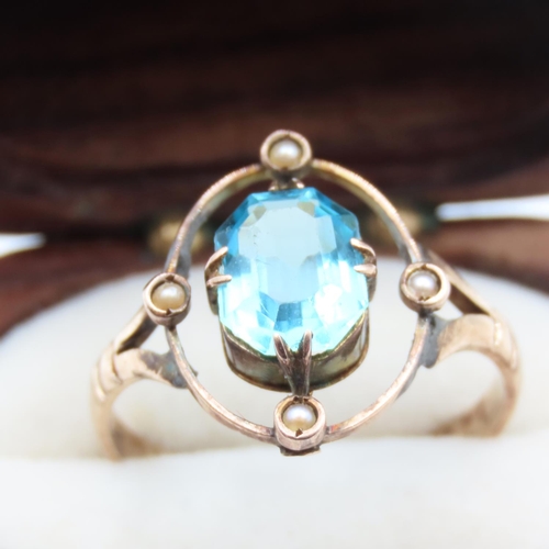 123 - Blue Topaz and Pearl Set Ring Mounted in 9 Carat Yellow Gold Ring Size R