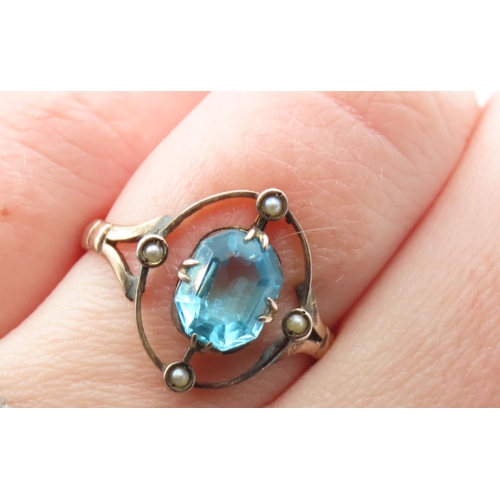 123 - Blue Topaz and Pearl Set Ring Mounted in 9 Carat Yellow Gold Ring Size R