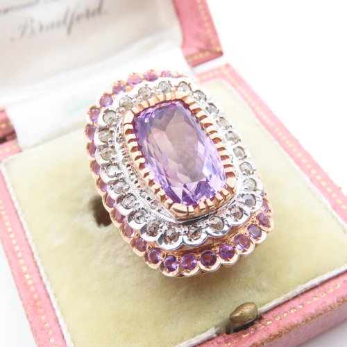 222 - Diamond and Amethyst Cluster Ring Centerstone Cushion Cut Mounted on 9 Carat Yellow Gold Band Basket... 