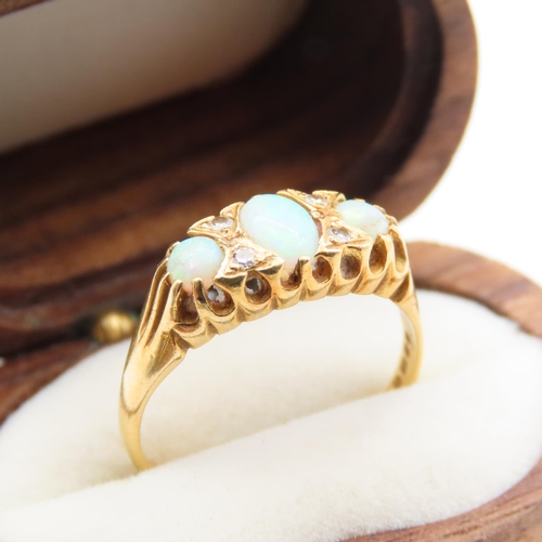 234 - Three Stone Opal and Diamond Rind Mounted on 18 Carat Yellow Gold Band Size M