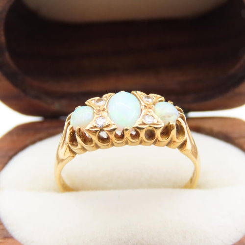 234 - Three Stone Opal and Diamond Rind Mounted on 18 Carat Yellow Gold Band Size M