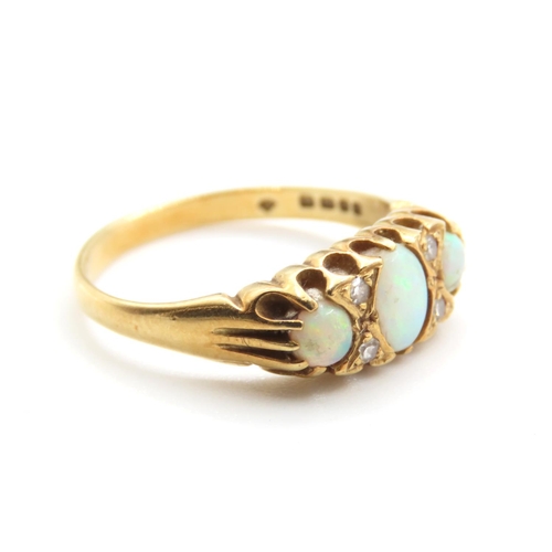 234 - Three Stone Opal and Diamond Rind Mounted on 18 Carat Yellow Gold Band Size M