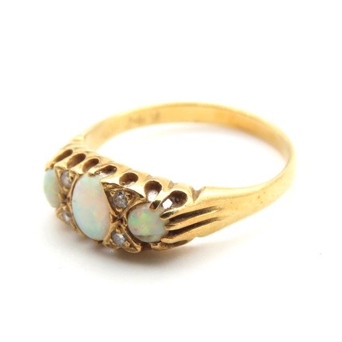 234 - Three Stone Opal and Diamond Rind Mounted on 18 Carat Yellow Gold Band Size M