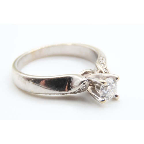 235 - 18 Carat White Gold Diamond Solitaire Ring with Further Diamonds to Shoulders Ring Size N