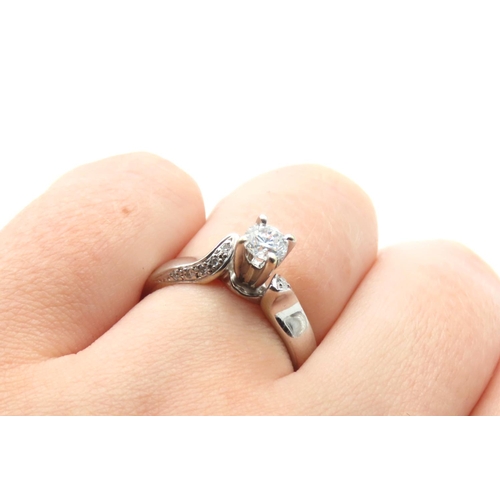 235 - 18 Carat White Gold Diamond Solitaire Ring with Further Diamonds to Shoulders Ring Size N