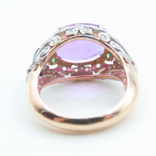 242 - Amethyst Four Claw Set Ladies Ring Diamond Decorated Surrounds with Inset Emeralds 9 Carat Rose Gold... 