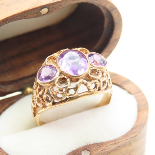 516 - Three Stone Amethyst Ladies Ring Mounted on 9 Carat Yellow Gold Openwork Scroll Setting Ring Size O