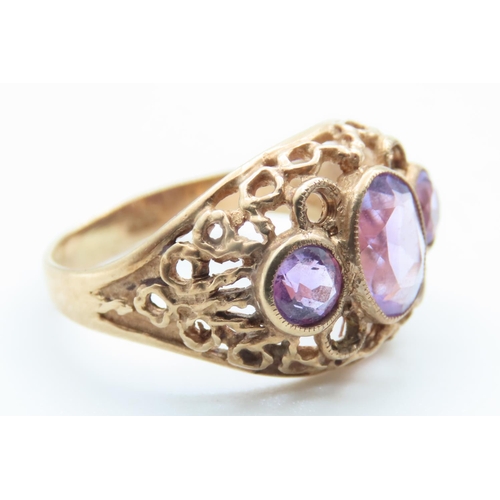 516 - Three Stone Amethyst Ladies Ring Mounted on 9 Carat Yellow Gold Openwork Scroll Setting Ring Size O