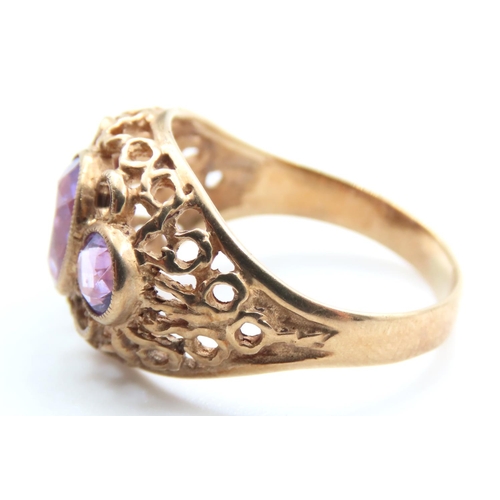 516 - Three Stone Amethyst Ladies Ring Mounted on 9 Carat Yellow Gold Openwork Scroll Setting Ring Size O