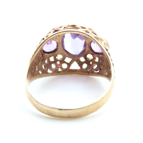 516 - Three Stone Amethyst Ladies Ring Mounted on 9 Carat Yellow Gold Openwork Scroll Setting Ring Size O