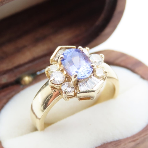 82 - Tanzanite and Diamond Ladies Cluster Ring Set in 14 Carat Yellow Gold Ring Size M and a Half