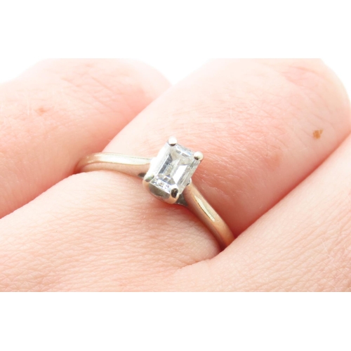 83 - Emerald Cut Diamond Solitaire Ring Set on 18 Carat White Gold Ring Size M