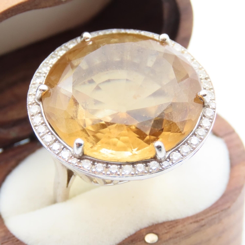 86 - Citrine Statement Ring with Diamond Halo set in 18 Carat White Gold Ring Size O