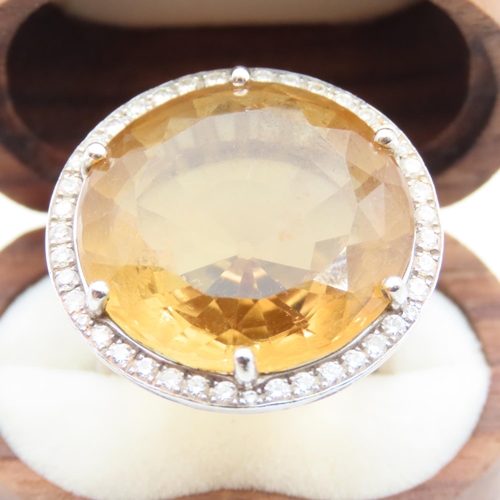 86 - Citrine Statement Ring with Diamond Halo set in 18 Carat White Gold Ring Size O